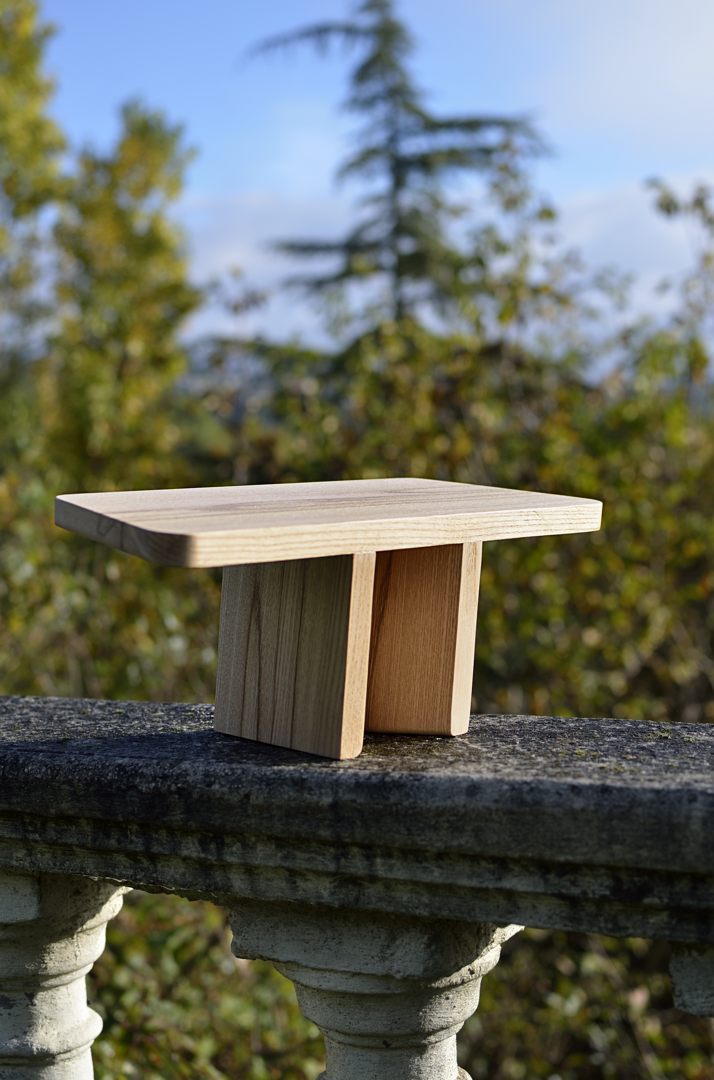 white wooden table with orange pumpkin on top